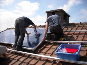 solar panels being installed on a roof top